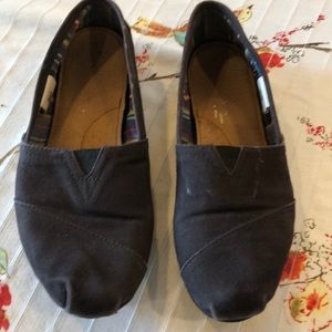 Well loved black Toms